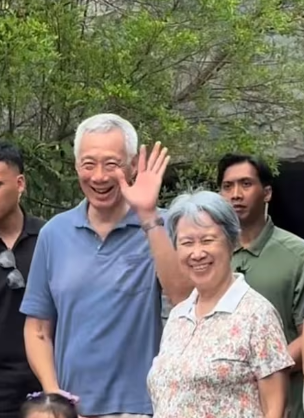 新加坡街头艺人自拍表演,意外“捕获”李显龙夫妇
